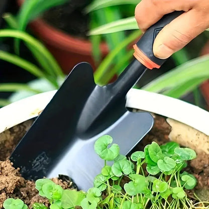 A Set of Four Outdoor Gardening Tools Including a Small Shovel for Planting Flowers, a Five-Pronged Rake, a Double-Headed Rake, Metal Tool Kit
