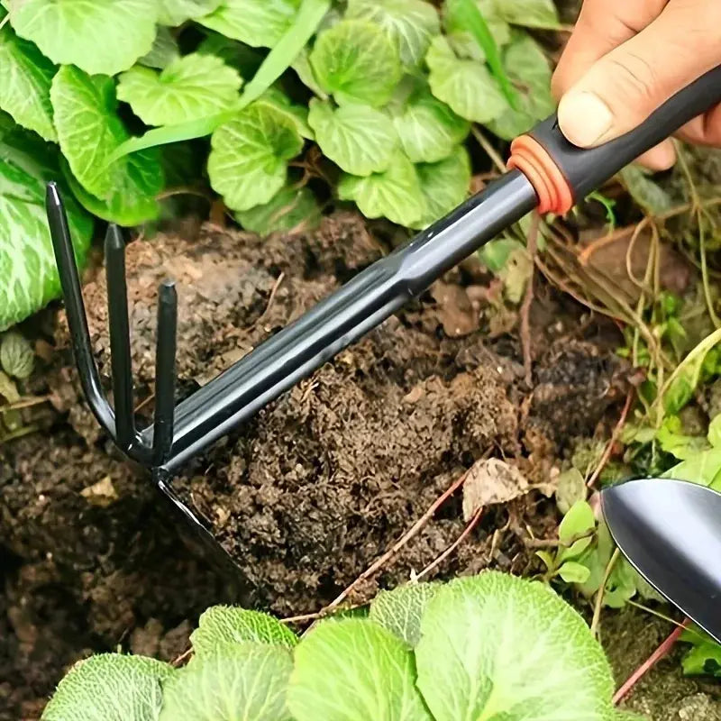A Set of Four Outdoor Gardening Tools Including a Small Shovel for Planting Flowers, a Five-Pronged Rake, a Double-Headed Rake, Metal Tool Kit