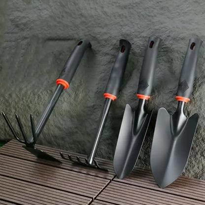 A Set of Four Outdoor Gardening Tools Including a Small Shovel for Planting Flowers, a Five-Pronged Rake, a Double-Headed Rake, Metal Tool Kit