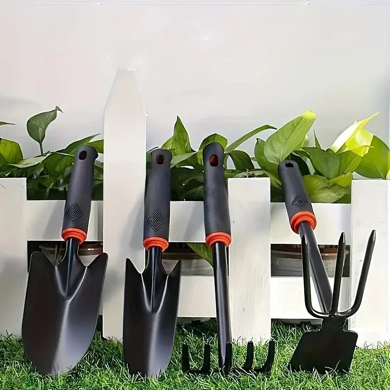 A Set of Four Outdoor Gardening Tools Including a Small Shovel for Planting Flowers, a Five-Pronged Rake, a Double-Headed Rake, Metal Tool Kit